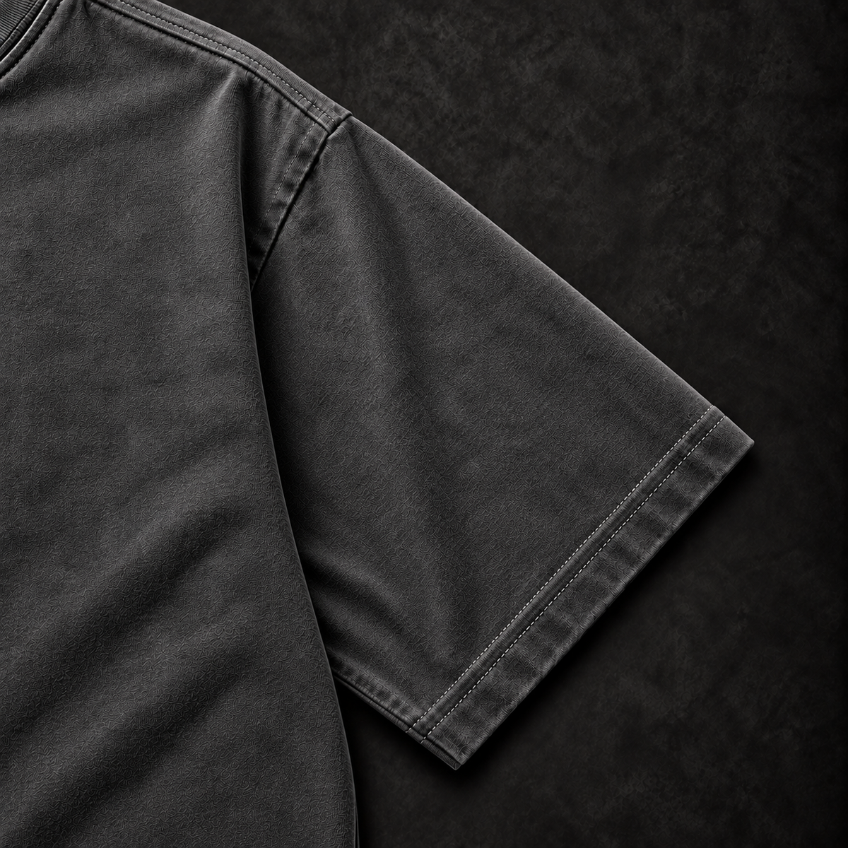 Charcoal Manai Falls tee sleeve and stitching detail