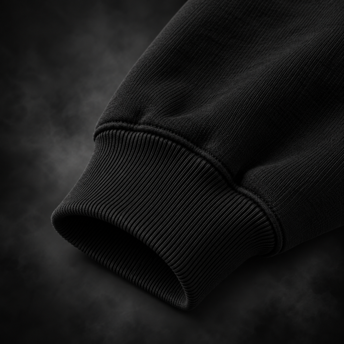 Close-up of the ribbed cuff and fabric on the Yonakasaku black hoodie