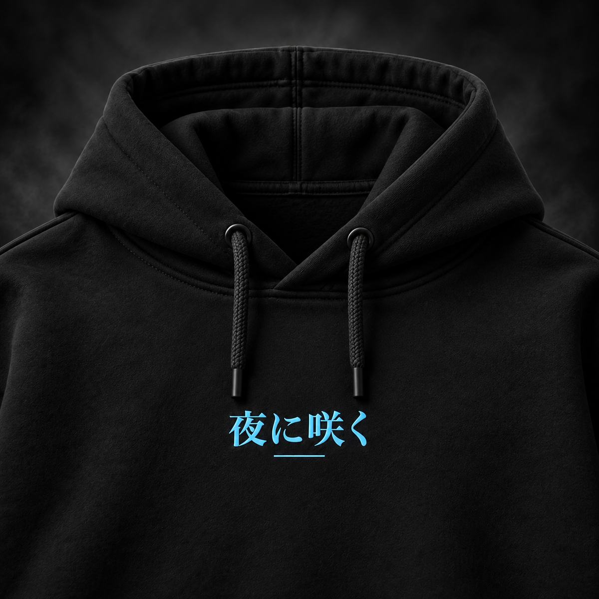 Close-up of the electric blue Japanese front print on the Yonakasaku black hoodie